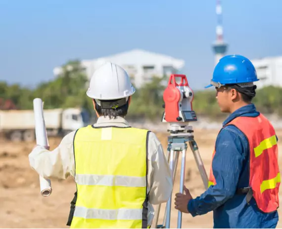 Two members of the Austin Engineering team perform Commercial Surveys in the Quad Cities